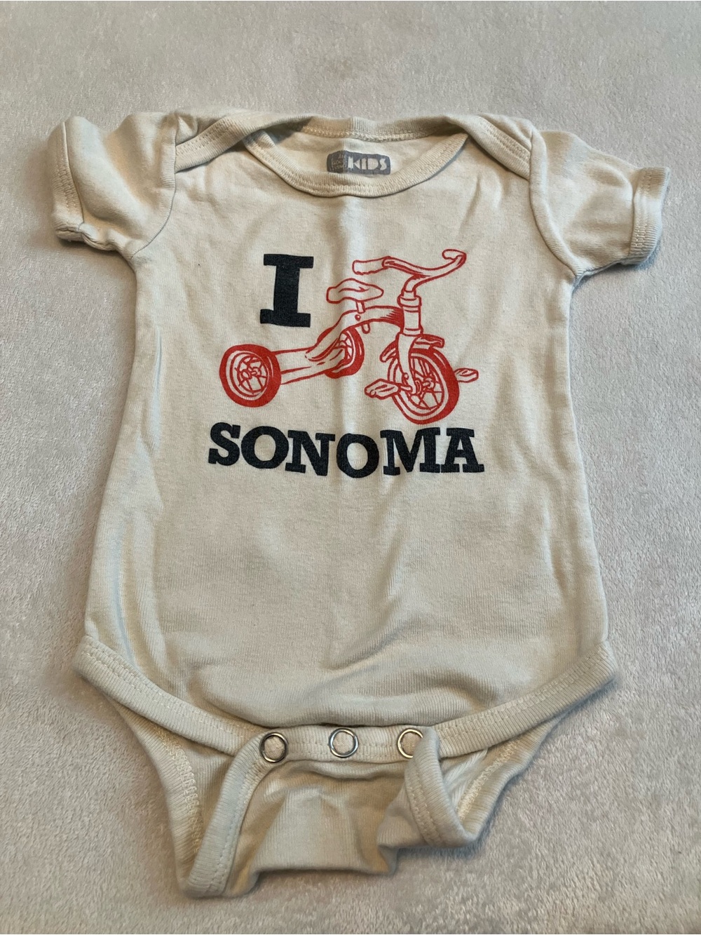 Organic Sonoma Cream Bodysuit with Red Tricycle Graphic